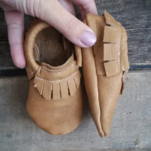 Tan mocc with short fringe